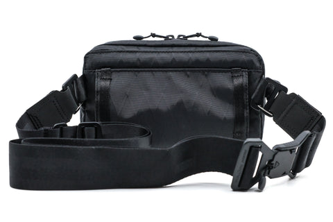 An Alpha pack from the back with strap and Fidlock buckle | Color: Black VX | Size: 1.8L