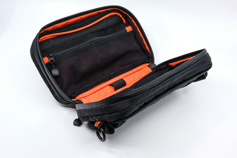 An Alpha Pack open at three quarter angle showing its compartments | Color: Black VX | Size: 1.8L