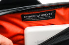 Alpha Pack interior close up showing magsafe battery, pen, notebook and label | Color: Black VX | Size: 1.8L