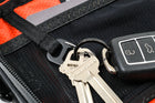 Alpha Pack interior close up showing carabiner with keys and label | Color: Black VX | Size: 1.8L