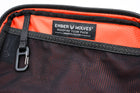 Alpha Pack interior close up showing carabiner and label | Color: Black VX | Size: 1.8L