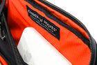 Alpha Pack interior close up showing MagSafe battery pack attached | Color: Black VX | Size: 1.8L
