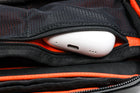 Alpha Pack interior close up showing zippered pocket with airpods case sticking out and pen in the pen holder | Color: Black VX | Size: 1.8L