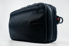 An Alpha Pack shown from the front at a three quarter angle  | Color: Black VX | Size: 2.6L
