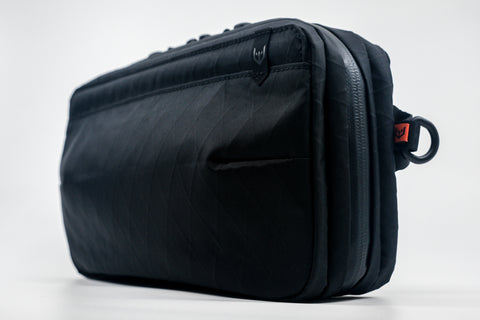 An Alpha Pack shown from the front at a three quarter angle  | Color: Black VX | Size: 2.6L