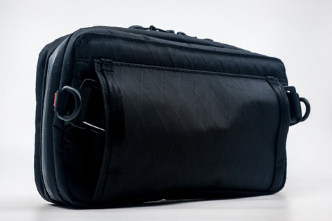 An Alpha Pack shown from the back at a three quarter angle | Color: Black VX | Size: 2.6L