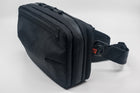 An Alpha Pack shown with strap from the front at a three quarter angle.  | Color: Black VX | Size: 2.6L