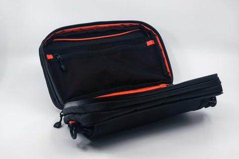 An Alpha Pack shown open so internal pockets with zipper are displayed  | Color: Black VX | Size: 2.6L
