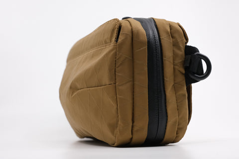 An Alpha Pack shown from the front and side | Color: Brown VX | Size: 1.8L