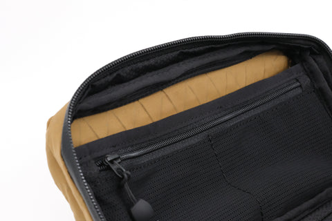 An Alpha Pack's inside showing the zip pocket  | Color: Brown VX | Size: 1.8L