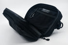 An Alpha Pack shown open and displaying a built-in carabiner and label tag  | Color: Tactical Black | Size: 1.8L