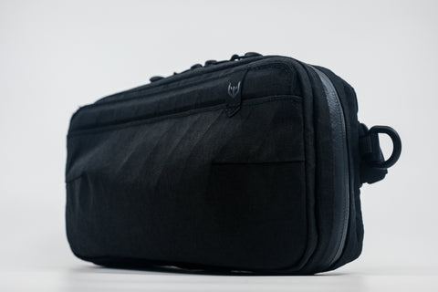 An Alpha Pack shown from a slight angle  | Color: Tactical Black | Size: 1.8L