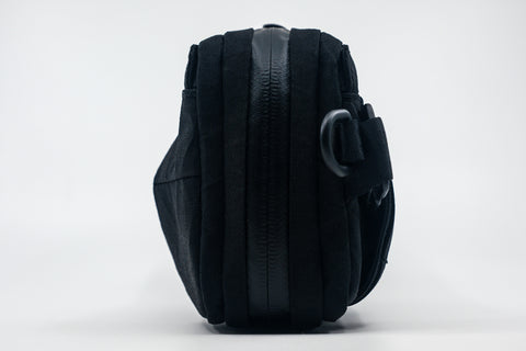 An Alpha Pack shown from the side  | Color: Tactical Black | Size: 1.8L