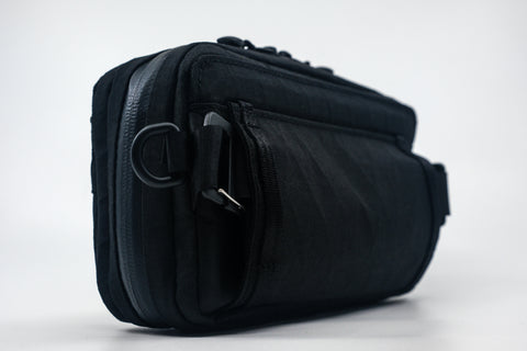 An Alpha Pack from the back at a three quarter angle  | Color: Tactical Black | Size: 1.8L