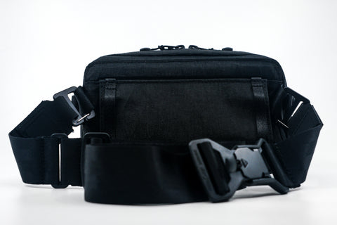 An Alpha Pack from the back with strap and Fidlock buckle | Color: Tactical Black | Size: 1.8L
