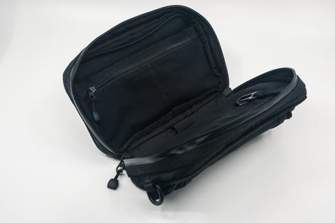 An Alpha Pack shown open and displaying its internal pockets  | Color: Tactical Black | Size: 1.8L
