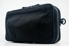 An Alpha Pack with a small white logo, shown from a three-quarters angle. | Color: Tactical Black | Size: 2.6L