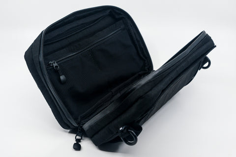 An Alpha Pack displaying its internal compartments. | Color: Tactical Black | Size: 2.6L